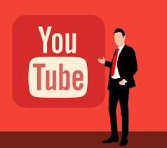 man standing along the YouTube logo